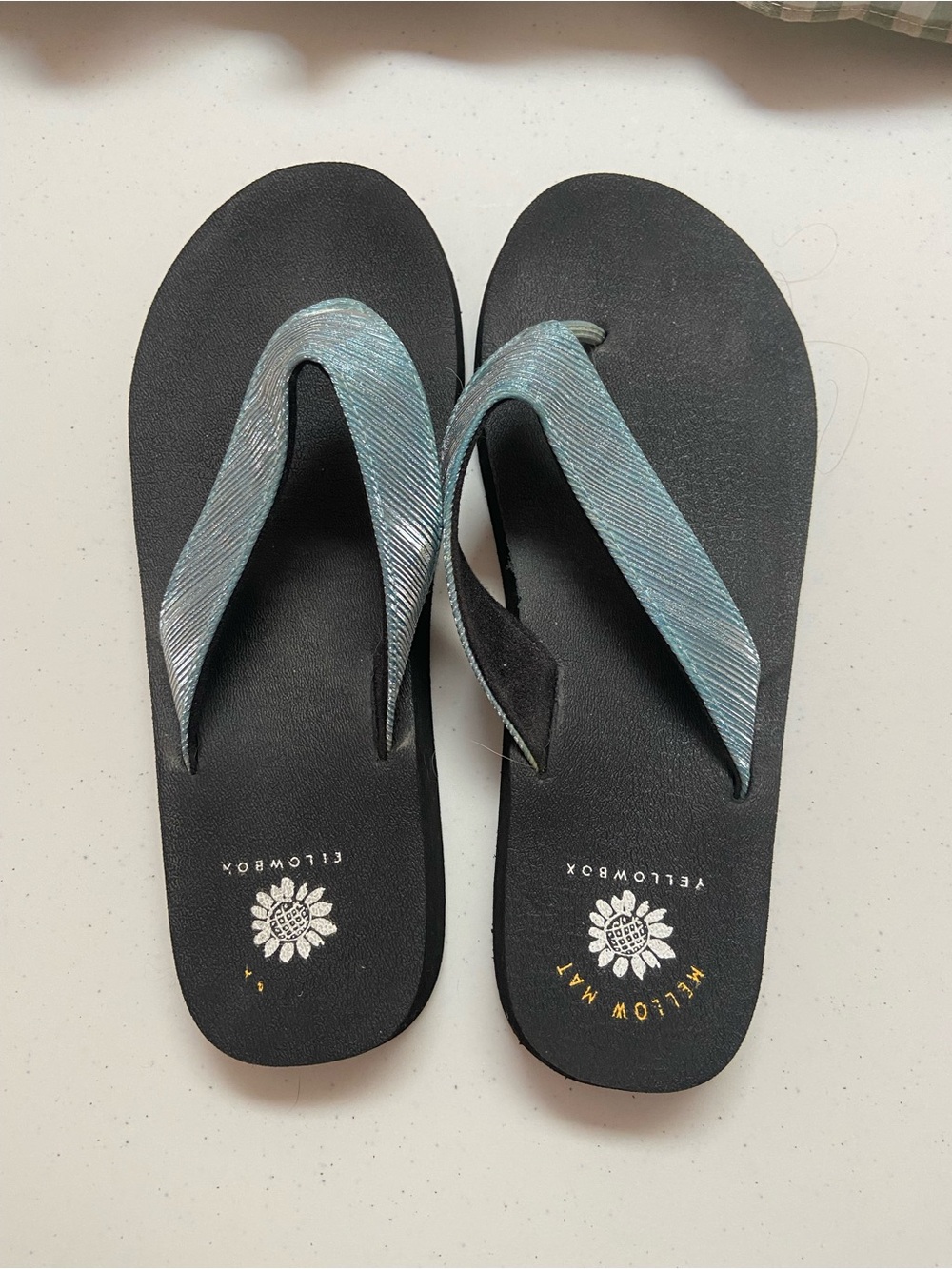 Yellow box flip flops